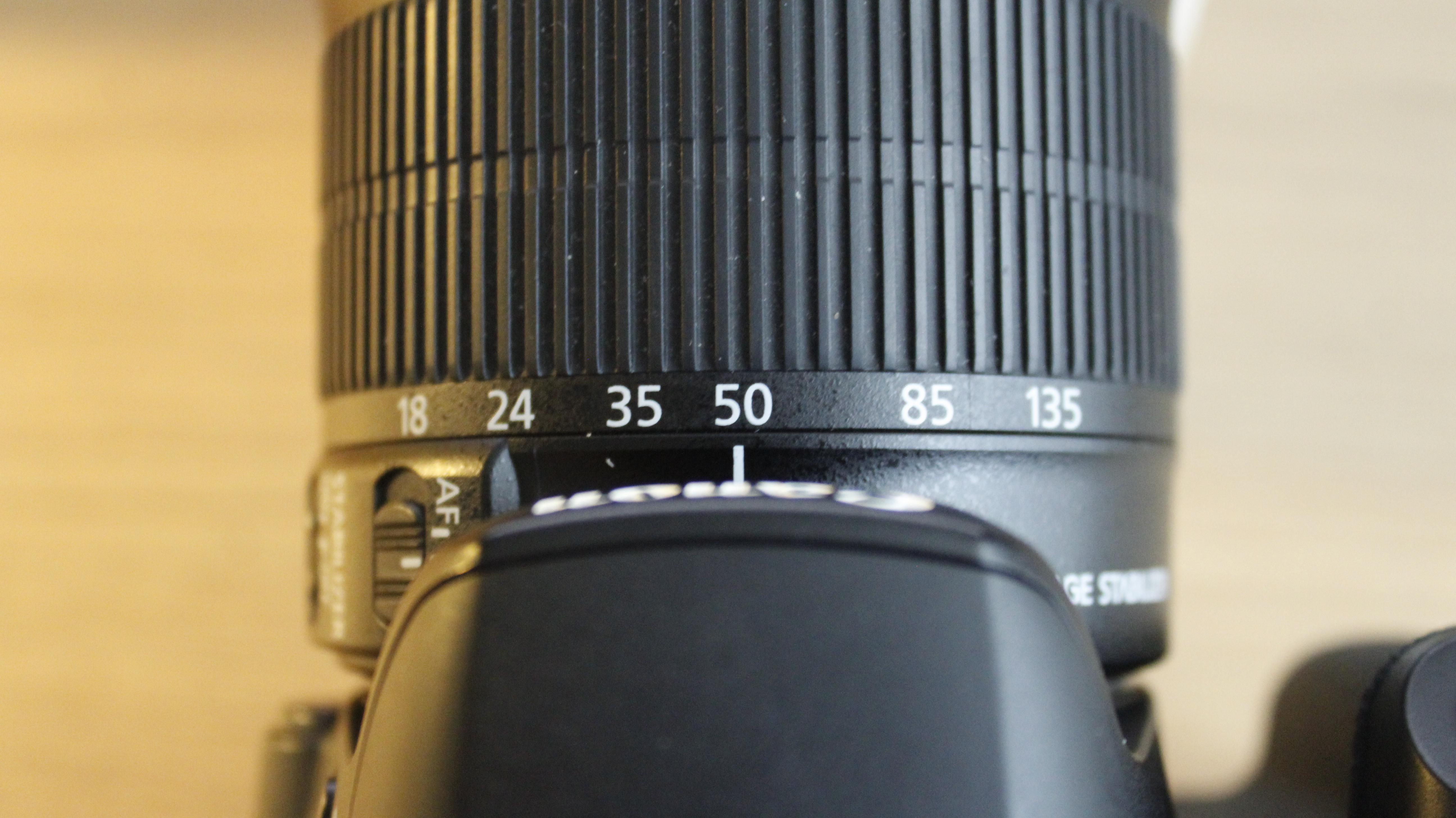 Canon 18–135 mm lens set to 50 mm. The white line indicator is aligned with 50.